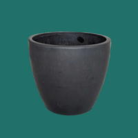 Black pot on a green  background by House of Agave.